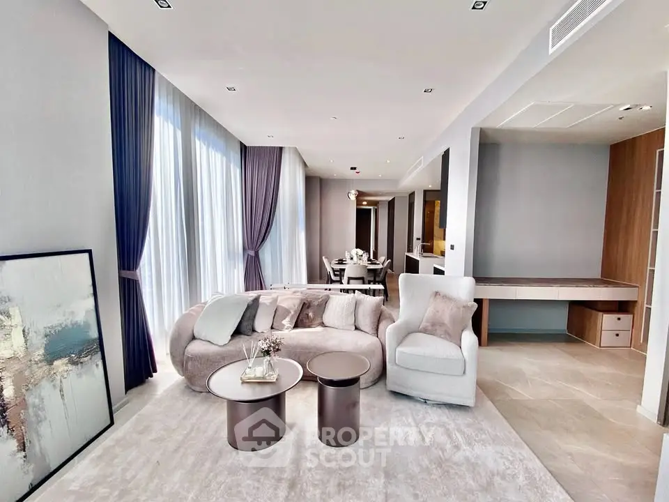Luxurious modern living room with elegant furniture and floor-to-ceiling windows