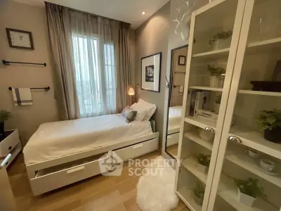 Cozy bedroom with stylish decor and ample storage in modern apartment