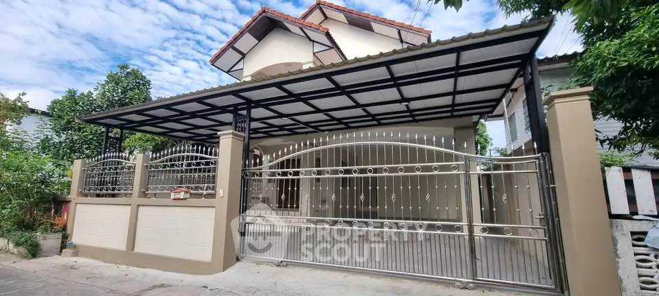 Charming two-story house with gated entrance and spacious driveway