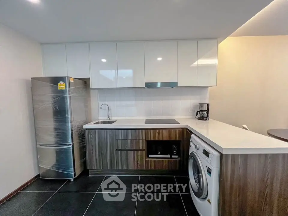 Modern kitchen with sleek appliances and stylish cabinetry