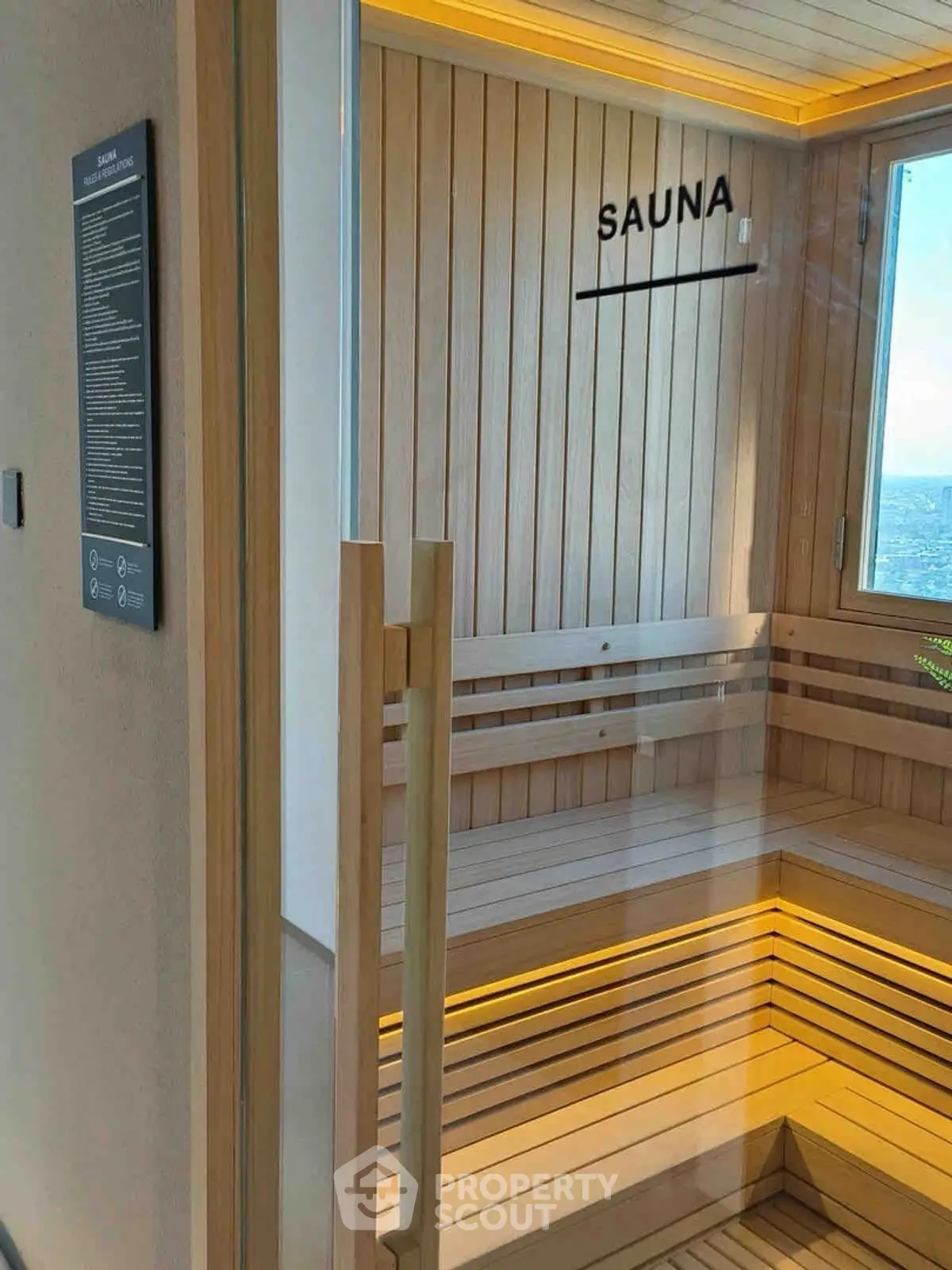 Luxurious sauna room with wooden benches and ambient lighting in a modern building.