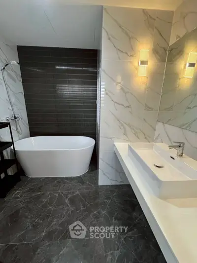 Luxurious modern bathroom with elegant bathtub and stylish lighting