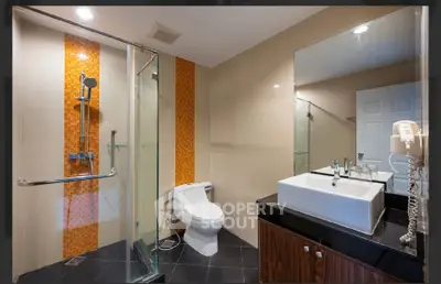 Modern bathroom with glass shower and stylish vanity