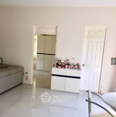 Spacious living room with modern decor and plush sofa