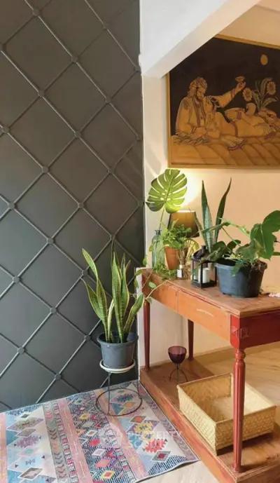 Charming living room corner with stylish decor and lush indoor plants