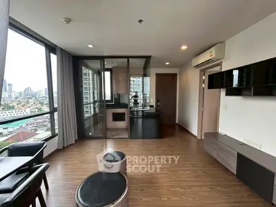 Modern apartment with city view, wooden flooring, and sleek interior design.