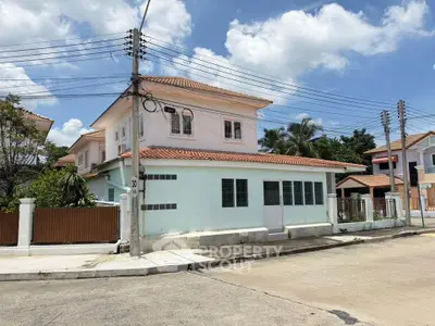 Charming two-story house with tiled roof in a serene neighborhood, perfect for family living.