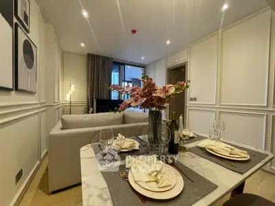 Elegant living room with dining area, featuring modern decor and cozy ambiance.