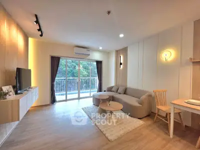 Spacious modern living room with balcony and stylish decor