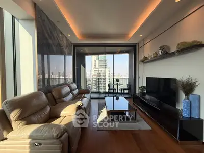 Luxurious living room with modern decor and stunning city view balcony