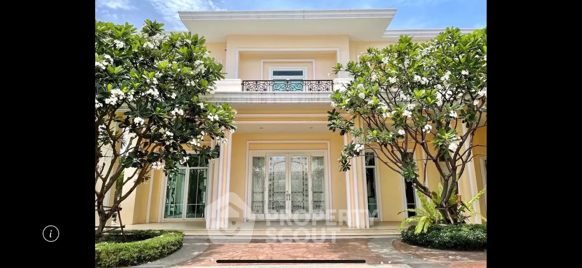 Stunning luxury villa exterior with lush greenery and elegant architecture.