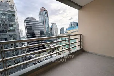 Spacious balcony with stunning cityscape view in modern urban setting.