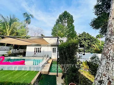 Charming tropical villa with pool and lush garden, perfect for relaxation and entertaining.