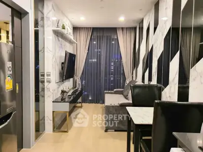 Modern living room with stylish decor and large windows in a high-rise apartment.