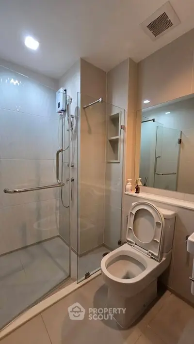 Modern bathroom with glass shower and sleek fixtures