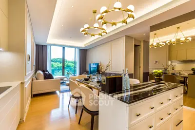Luxurious open-plan living and dining area with elegant lighting and scenic view.