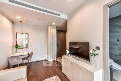 Modern living room with elegant dining area and sleek TV setup, perfect for urban living.