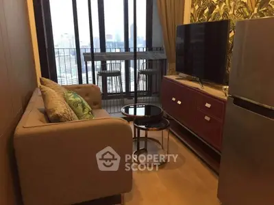 Stylish living room with city view, modern sofa, TV, and balcony seating in urban apartment.