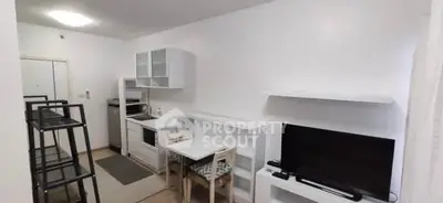 Cozy living room with modern furniture and entertainment setup, ideal for urban living.
