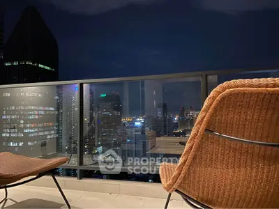 Stunning city skyline view from a modern balcony at night, perfect for urban living.