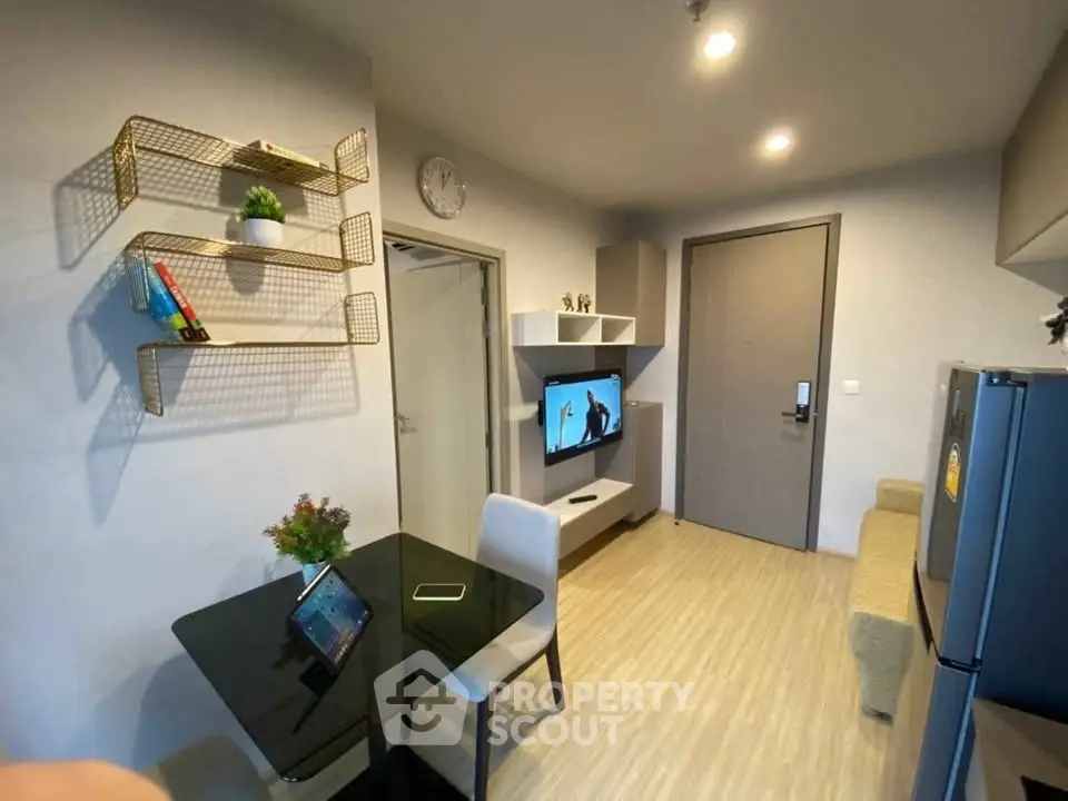 Modern living room with stylish decor and compact dining area