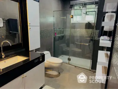 Modern bathroom with glass shower and sleek fixtures