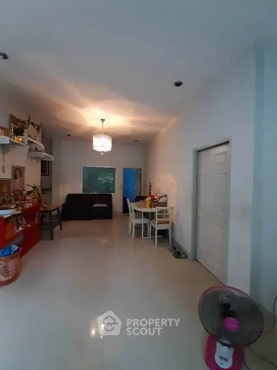 Spacious living room with modern decor and elegant lighting