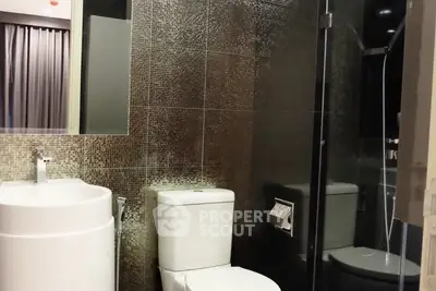 Modern bathroom with sleek design and glass shower enclosure