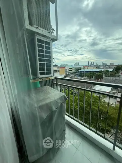 Charming balcony with city view, perfect for relaxation and enjoying the skyline.