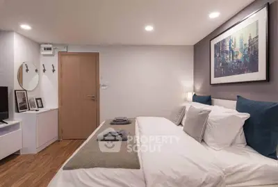 Cozy modern bedroom with stylish decor and soft lighting