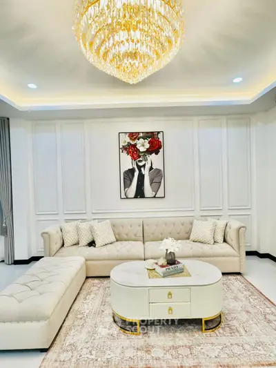 Luxurious living room with elegant chandelier and plush sectional sofa