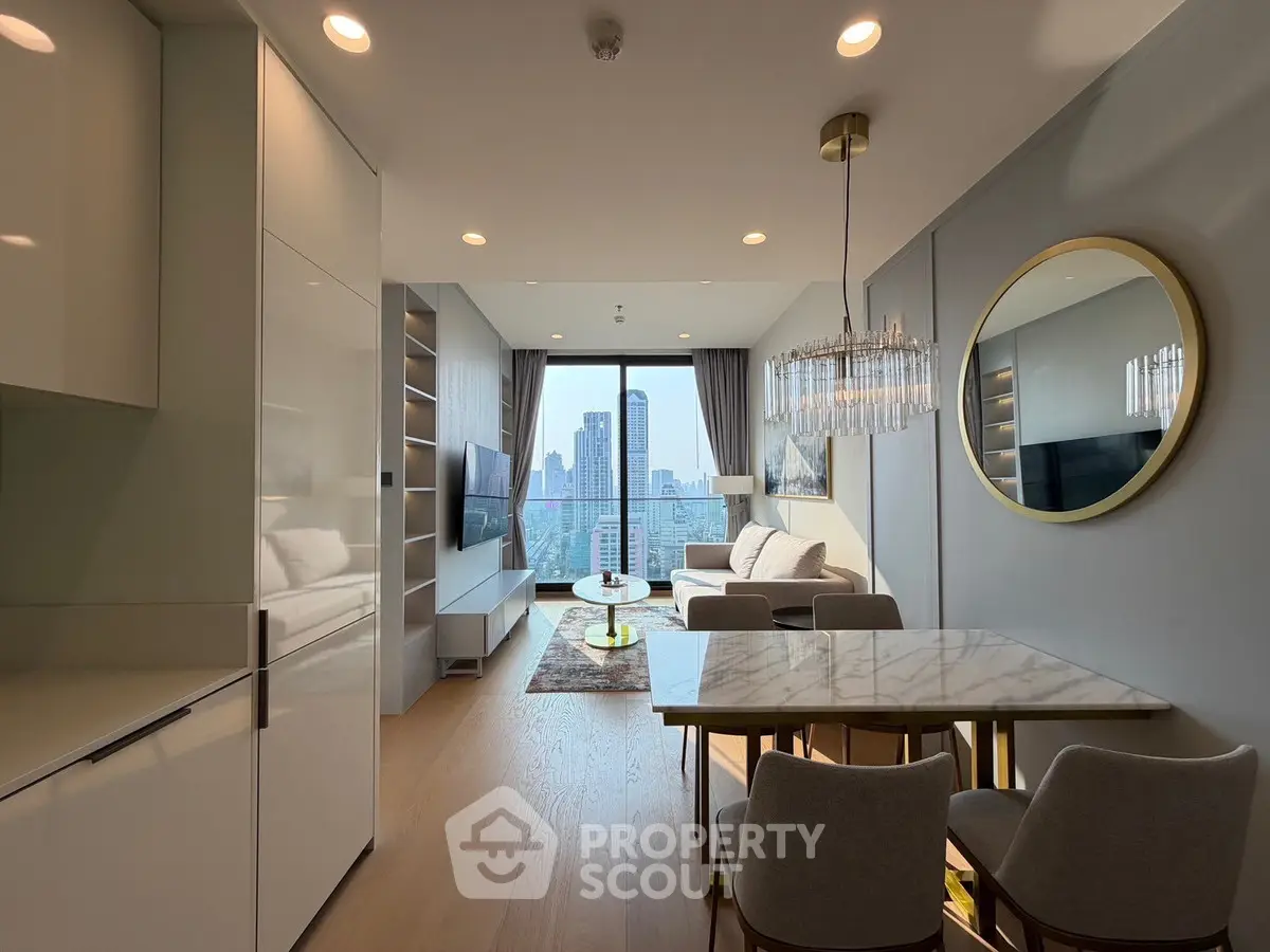 Luxurious modern living room with city view, elegant decor, and ample natural light.