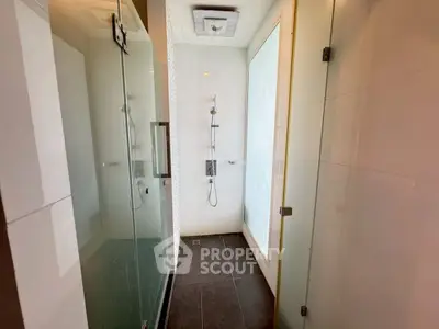 Modern bathroom with glass shower enclosure and sleek design