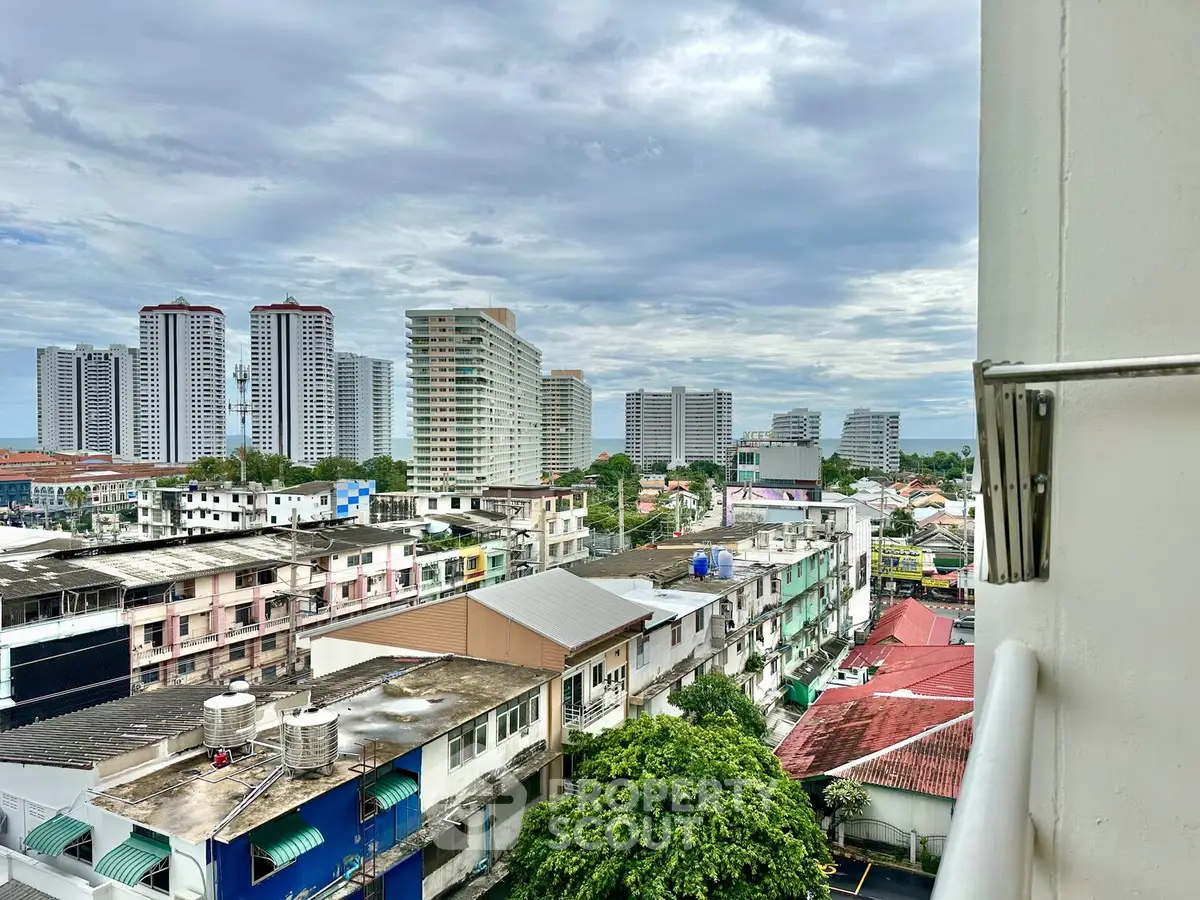Stunning cityscape view from a high-rise balcony showcasing urban living and skyline.