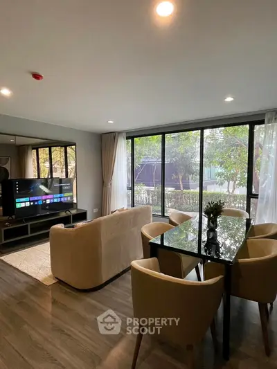 Modern living room with large windows and stylish furniture