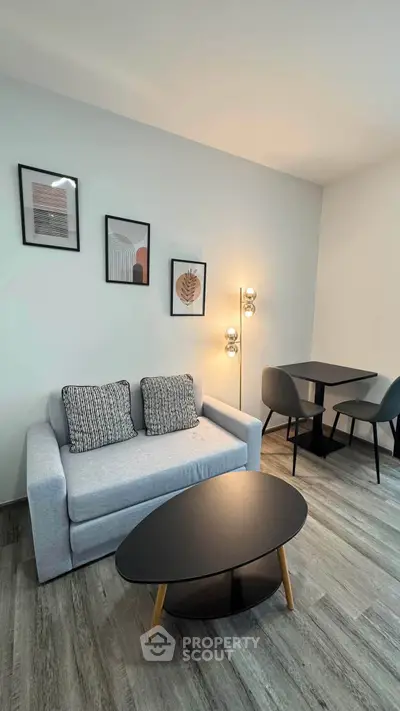 Modern living room with stylish decor and cozy seating area, perfect for relaxation and entertaining.
