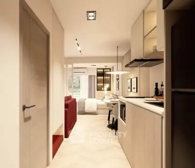 Modern open-plan apartment with stylish kitchen and cozy living area, perfect for urban living.