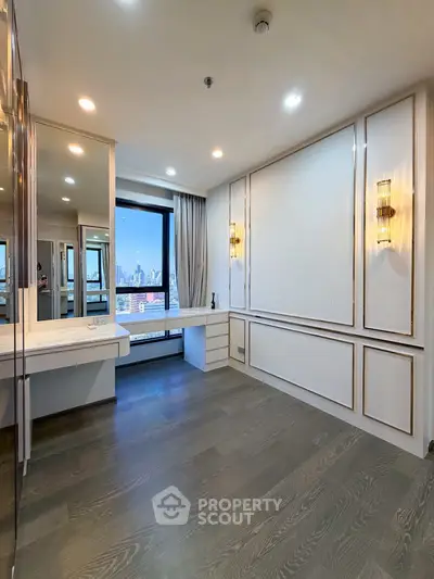 Spacious modern living room with city view and elegant lighting