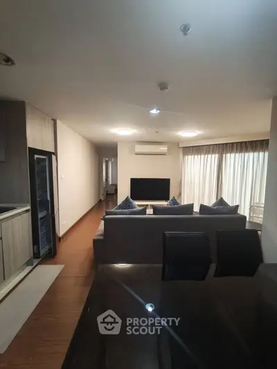 Spacious modern living room with sleek furniture and natural light