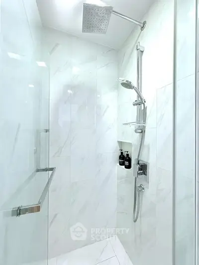 Luxurious modern bathroom shower with sleek marble tiles and rainfall showerhead