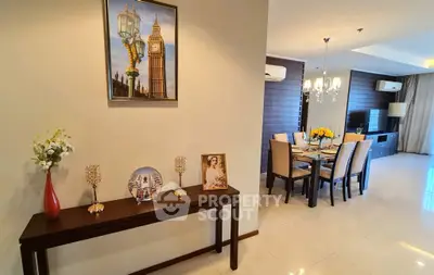 Elegant dining area with modern decor and stylish furniture in a spacious open-plan layout.