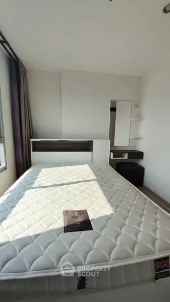 Bright and cozy bedroom with modern design and ample natural light.