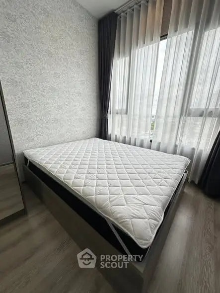 Modern bedroom with large window and stylish decor