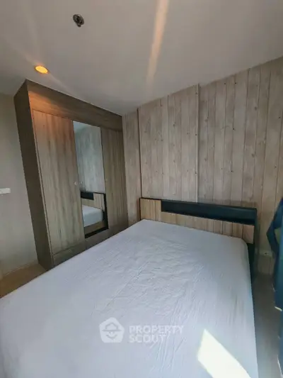 Cozy bedroom with wooden wardrobe and natural light