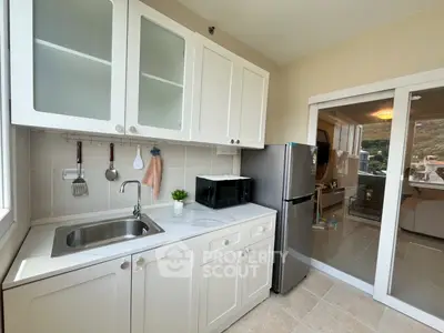 Modern kitchen with sleek cabinets and stainless steel appliances