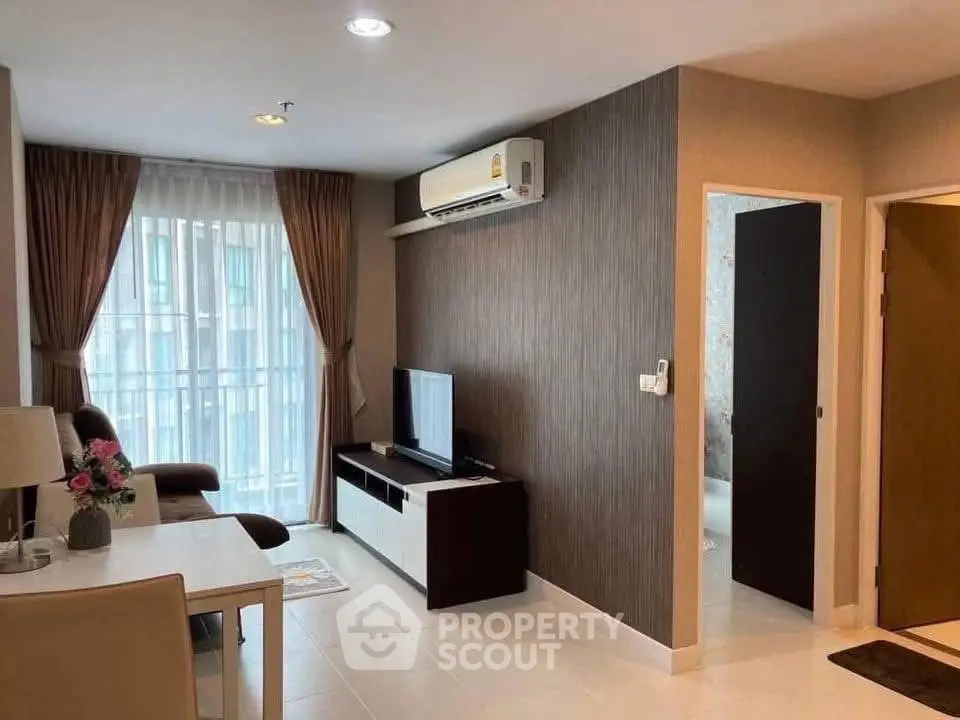 Modern living room with air conditioning and stylish decor in a cozy apartment.