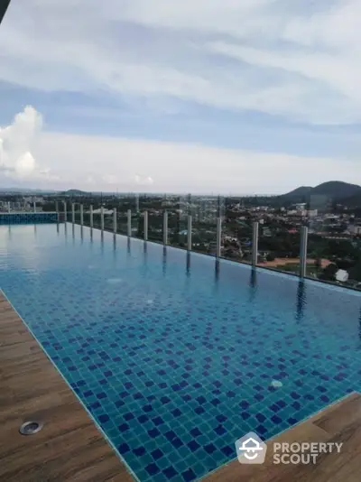 Stunning rooftop infinity pool with panoramic city and mountain views