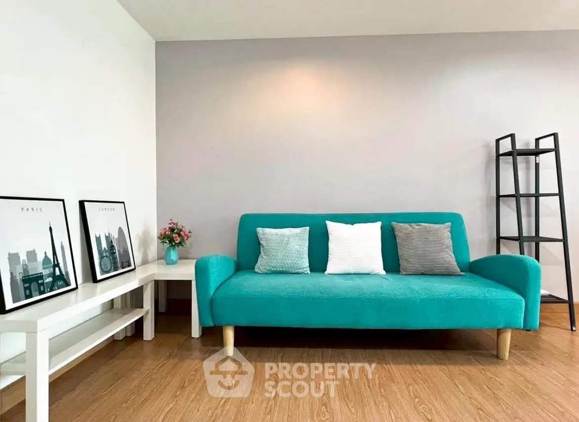 Modern living room with teal sofa and stylish decor