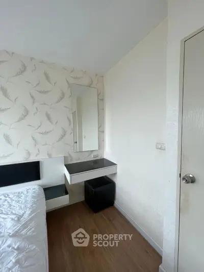 Cozy bedroom corner with modern decor and stylish wallpaper