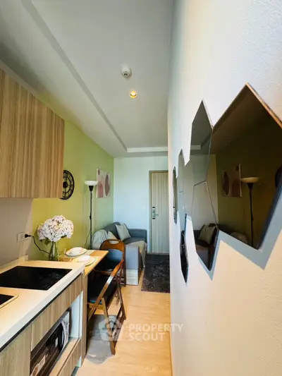 Modern compact living room with stylish decor and open kitchen layout